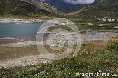 Spluegenpass with the Monte Spluga reservoir and surrounding mountains in summer Stock Photo