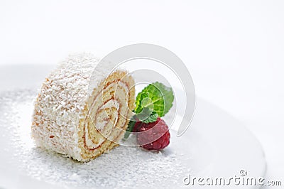 Sponge roll cake with cream and fruit decoration on white plate, on-line shop photography, patisserie, sweet dessert Stock Photo