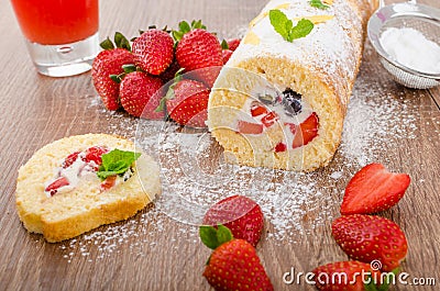 Sponge roll with strawberries and blueberries Stock Photo