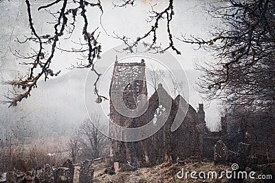 A spooky, abandoned graveyard with a ruined church in the background. With a vintage, grunge edit Stock Photo