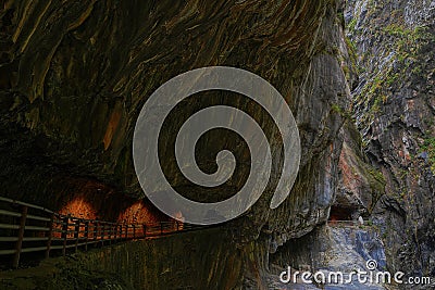 A spooky but beautiful road built along a mountain stream and canyons, in Taroko National Park Stock Photo