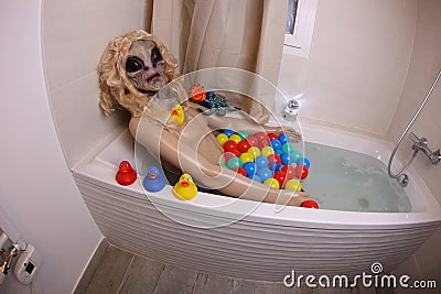 Spooky female alien in the bathtub Stock Photo