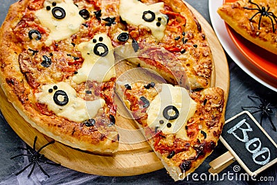Spooky ghost pizza, fun Halloween lunch Stock Photo