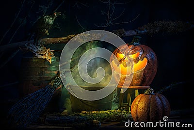 Spooky Halloween Jack-O-Lantern, Caldron at Night Stock Photo