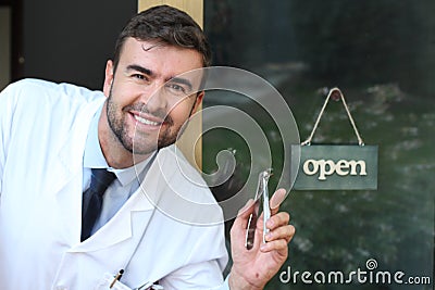 Spooky male dentist holding pliers Stock Photo