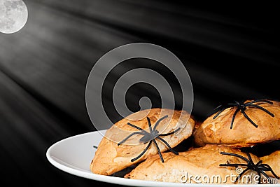 Spooky night trick or treat halloween food. Spider covered snack Stock Photo