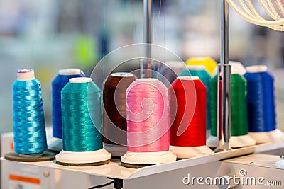 Spools of color threads closeup, sewing material Stock Photo