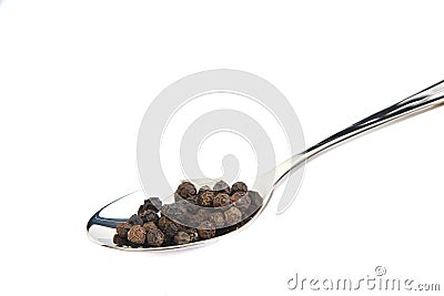 Spoon with black pepper Stock Photo