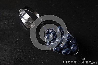 Spoon with blueberries.jpg Stock Photo