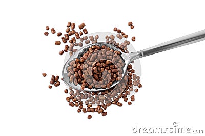 Spoon with buckwheat tea granules on white background, top view Stock Photo