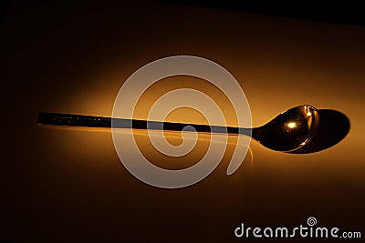 Spoon in the dark Stock Photo