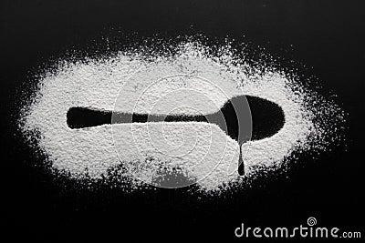 Spoon and drop silhouette made with flour Stock Photo