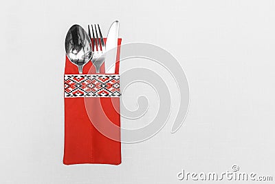 Spoon fork and knife cutlery utensil silverware in traditional ornament style on white tablecloth background Stock Photo