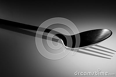 Spoon with a fork shadow Stock Photo