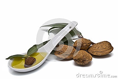 Spoon full of almond oil. Stock Photo