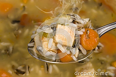 Spoon full of chicken and rice soup Stock Photo