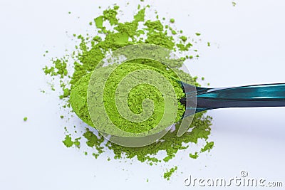 A spoon with powdered matcha green tea, isolated on light background, copy space, top view Stock Photo