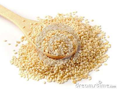 spoon with sesame seeds on a white background Stock Photo