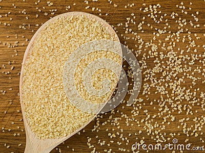 Spoonful of Dried Natural Bulgar Wheat Stock Photo