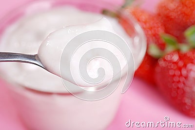 Spoonful of strawberry yogurt Stock Photo