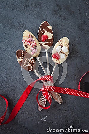 Spoons with chocolate Stock Photo