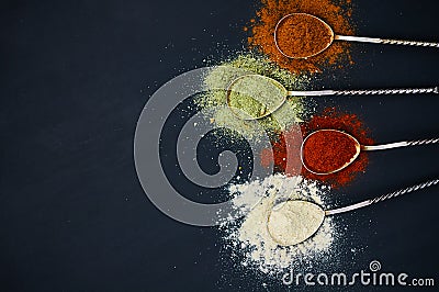 Spoons with various spices Stock Photo