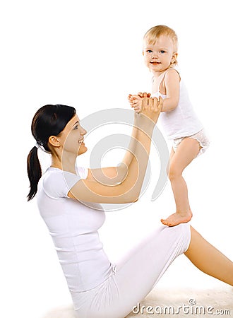 Sport, active, leisure and family concept - happy mom and baby Stock Photo