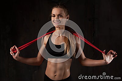 Sport, activity. Cute woman with skipping rope. Muscular girl bl Stock Photo