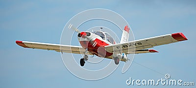 Sport airplane soaring in sky Editorial Stock Photo