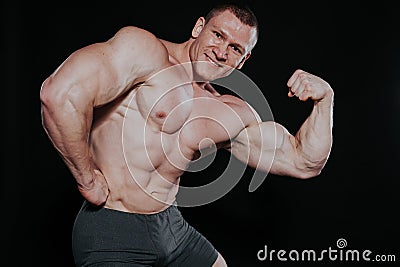 Sport the athlete bodybuilder shows off his muscles Stock Photo