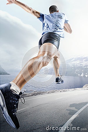 Sport backgrounds. Sprinter starting on the running track. Stock Photo