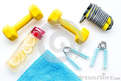 Sport with bars, towel, water and wrist builder white background top view space for text Stock Photo