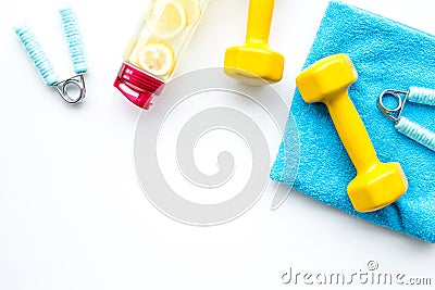 Sport with bars, towel, water and wrist builder white background top view space for text Stock Photo