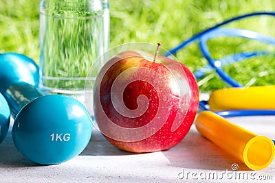 Sport diet and active healthy lifestyle springtime concept with outdoor exercise equipment Stock Photo