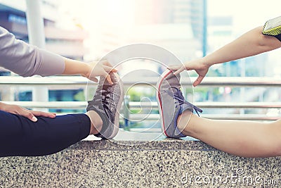 Sport exercise and healthy concept. Closeup people warmup before workout in the city. Stock Photo