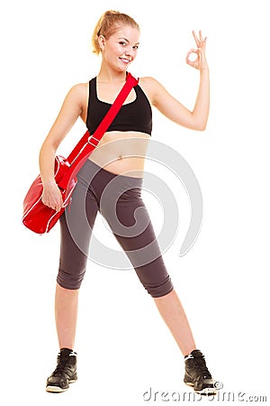 Sport. Fitness girl with gym bag showing ok hand sign Stock Photo