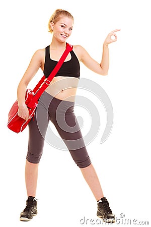 Sport. Fitness girl with gym bag showing ok hand sign Stock Photo