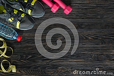 Sport fitness items on dark wooden background Stock Photo