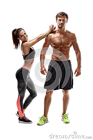 Sport, fitness, workout concept. Fit couple, strong muscular man and slim woman posing on a white background Stock Photo