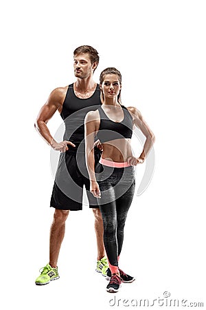 Sport, fitness, workout concept. Fit couple, strong muscular man and slim woman posing on a white background Stock Photo