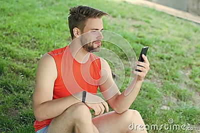 Sport gadget concept. Athlete with fitness tracker or pedometer. Man athlete on busy face setting up fitness tracker Stock Photo