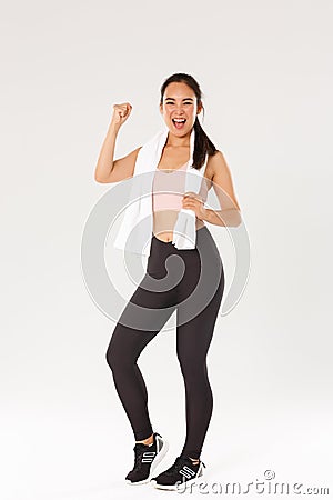Sport, gym and healthy body concept. Full length of encouraged and motivated asian brunette girl ready for fitness Stock Photo