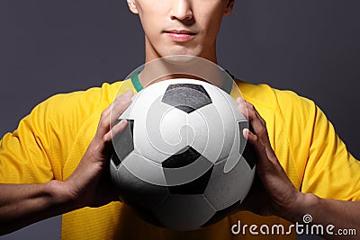 Sport man smile and holding soccer Stock Photo