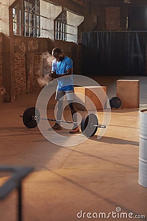 Sport man using hand chalk powder before workout at gym Stock Photo
