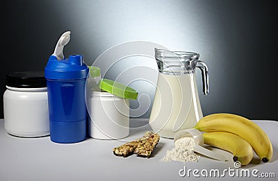 Sport Nutrition Supplement containers with jug of milk Stock Photo