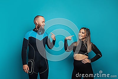 Sport people. Happy successful man and woman in fitness eguipment on blue background Stock Photo