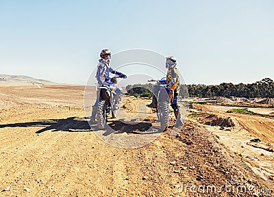 Sport, racer or relax on motorcycle outdoor on dirt road with blue sky for driving, challenge or competition. Gear Stock Photo