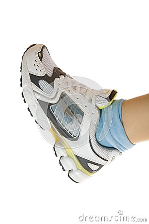 Sport shoe on woman leg. Stock Photo