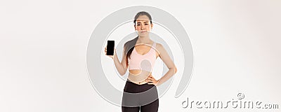 Sport, technology and active lifestyle concept. Dissatisfied and skeptical asian female athlete, sportswoman complaining Stock Photo