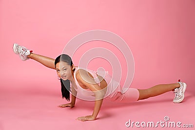 12-15 years old Asian Youth stretch lift up her flexible leg full length Stock Photo